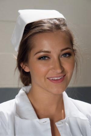 Gorgeous nurse with a nice butt Dani Daniels strips and poses in high heels