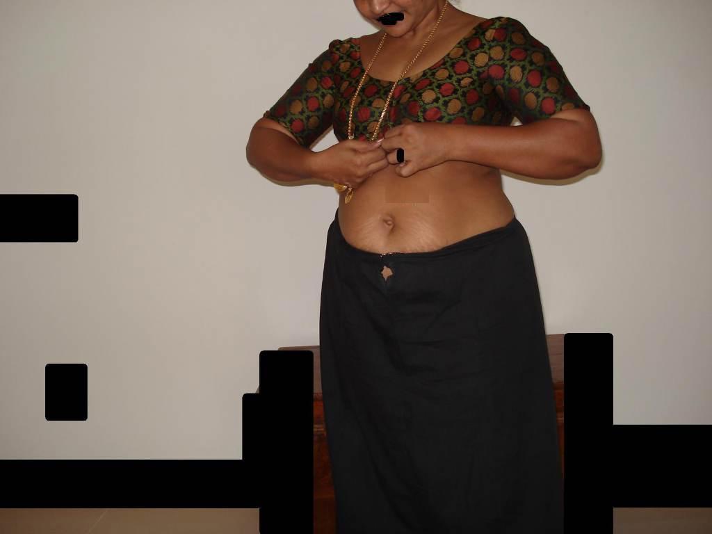 Overweight Indian housewife sports a braided ponytail while getting naked(1)
