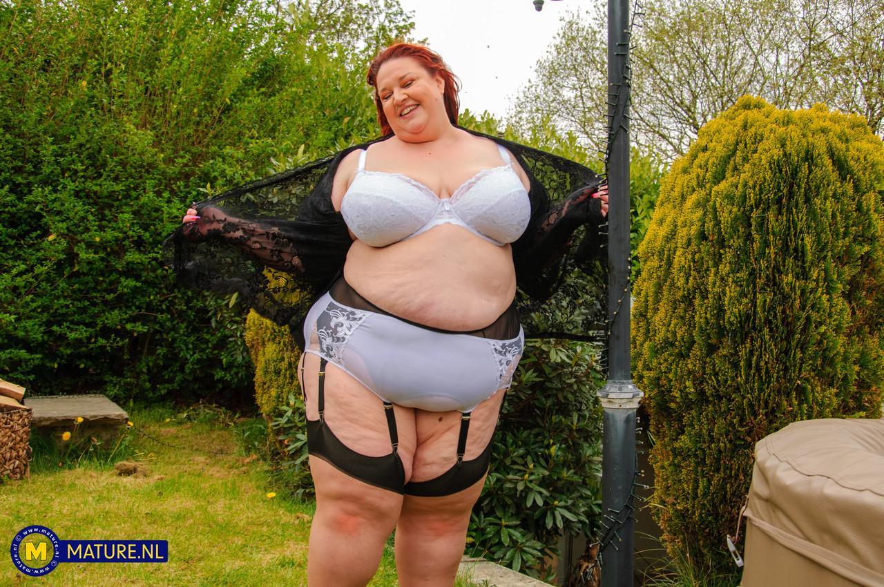 Morbidly obese older redhead dildos her snatch in a garter belt and nylons(3)