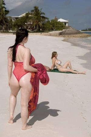 Big boobed lesbian Christy Marks seduces a busty female for sex on the beach