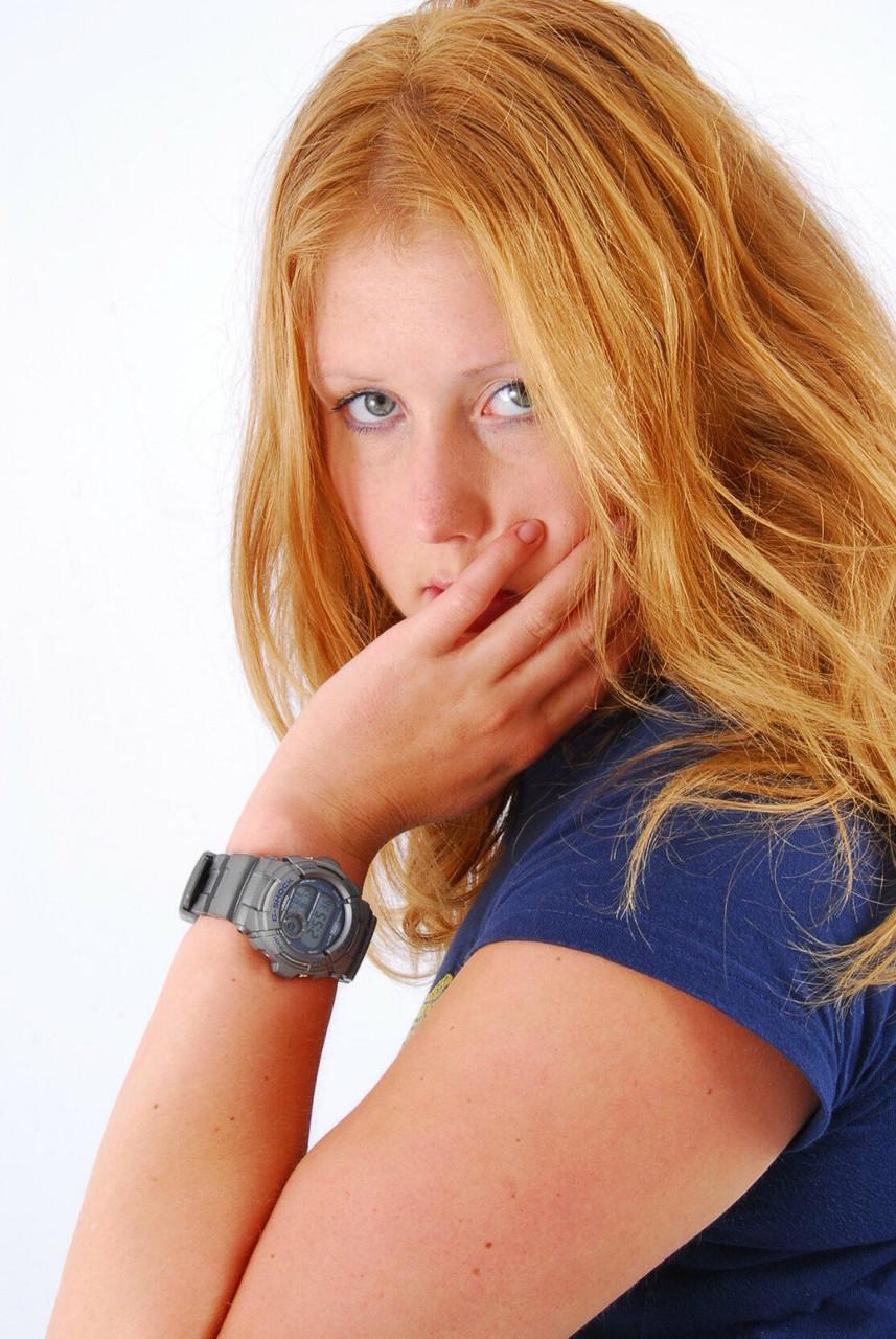 Natural redhead Judy displays her grey G-Shock watch in a T-shirt and jeans(3)