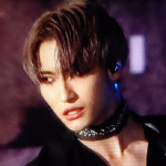 An icon of Pierce. He is looking fiercely off to the side, with a smirk. He is wearing a jeweled collar necklace, and a black shirt that shows off his chest.