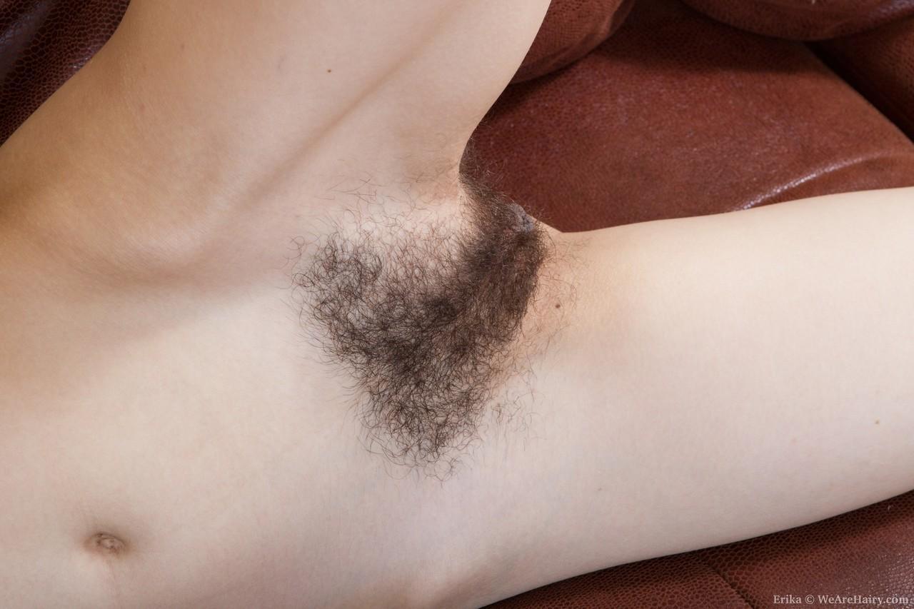 Slim teen with adorable hairy crotch Erika strips and poses on leather couch(17)