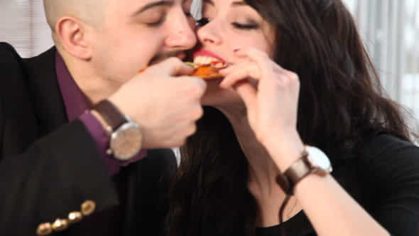 Couple Eating Pizza - VideoHive 10609368