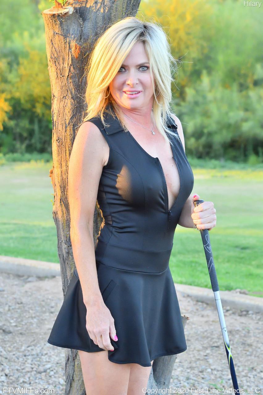 Seductress Hilary flashes her panties & shows her cleavage while playing golf(17)