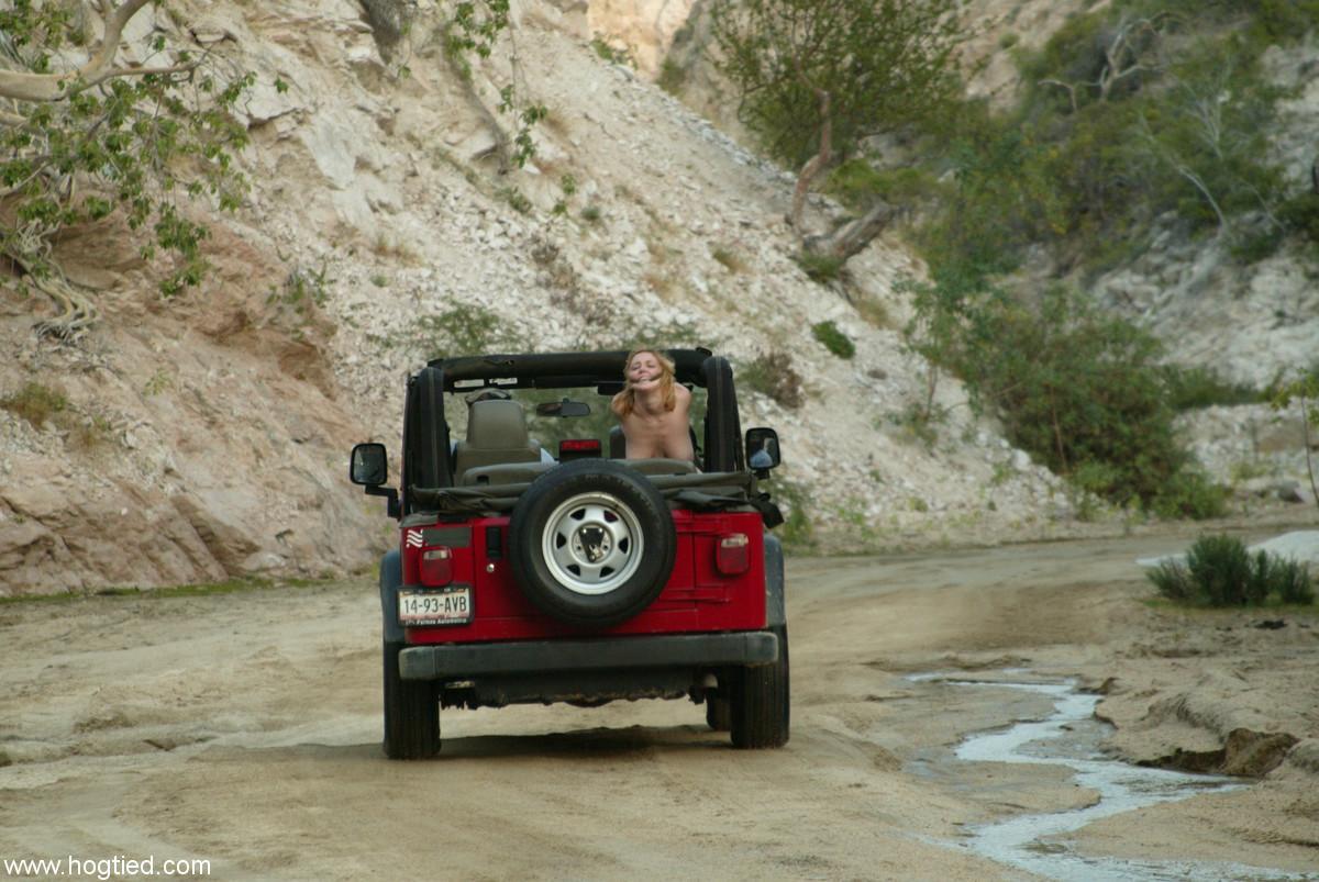 Naked MILF Dee Williams endures a rough offroad ride while standing in bondage(4)