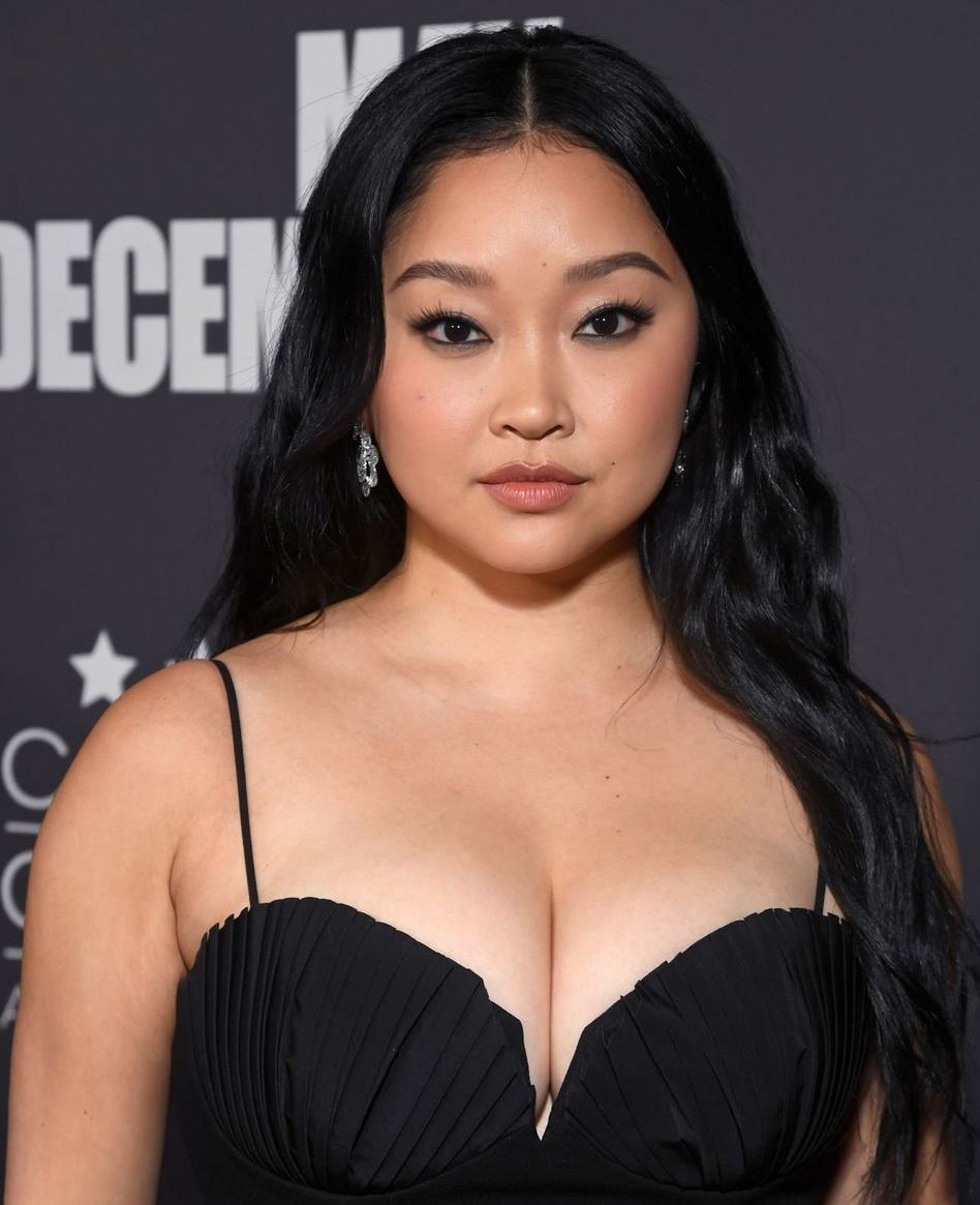 Lana Condor stuffs a lot of flesh into a tight blouse -