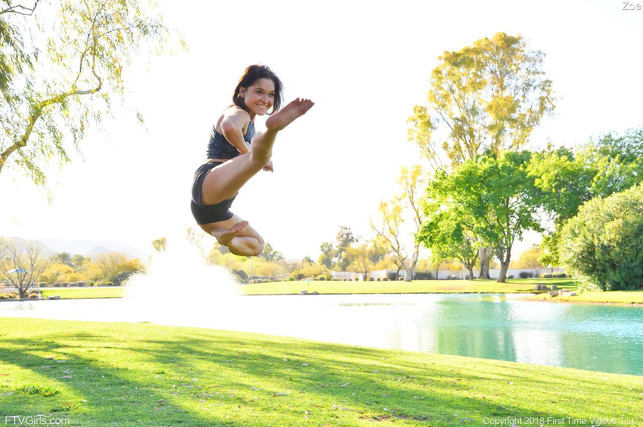 Teenage hottie in sexy outfit Zoe doing exercise outdoors by the water(10)