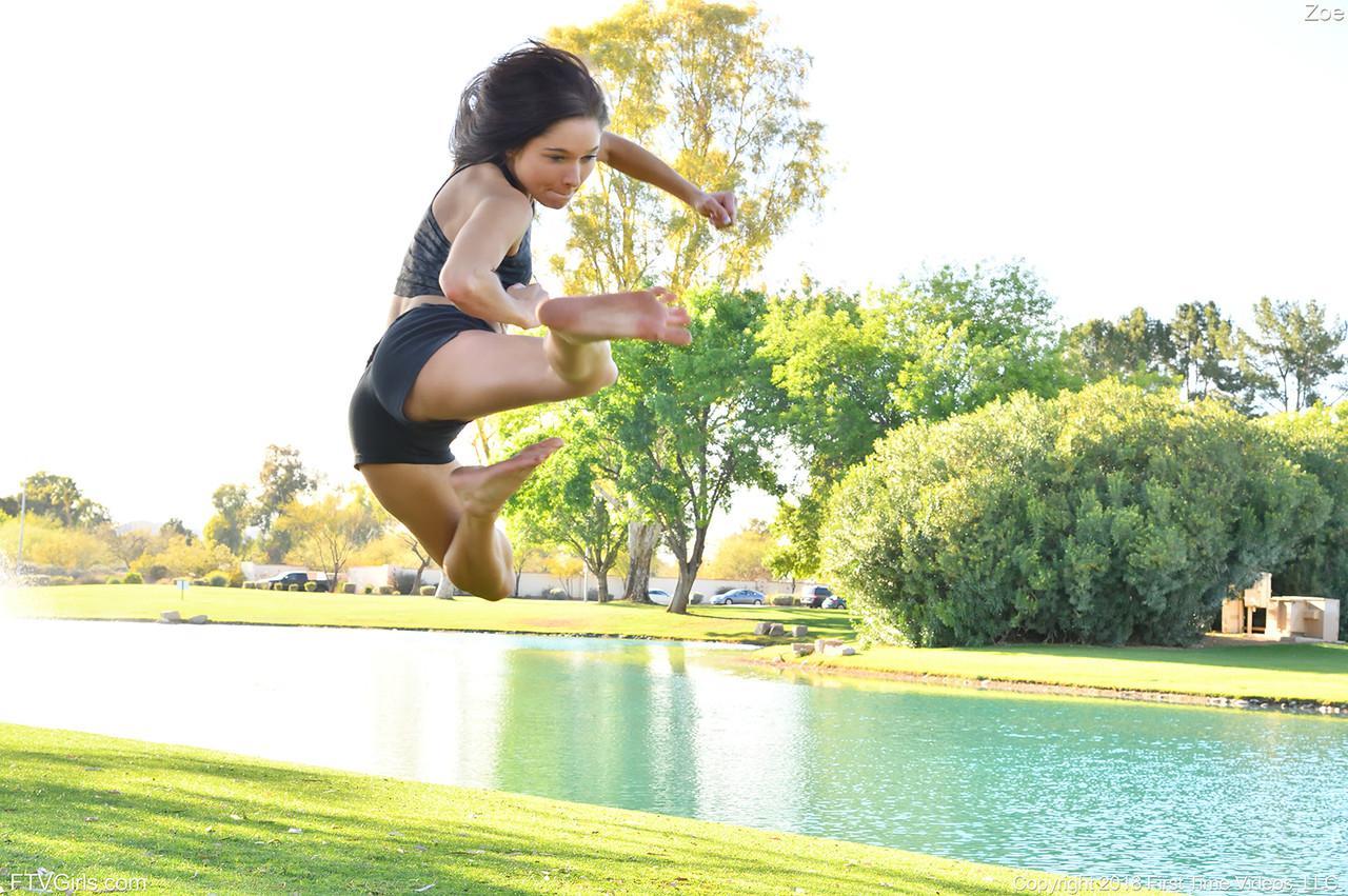 Teenage hottie in sexy outfit Zoe doing exercise outdoors by the water(7)