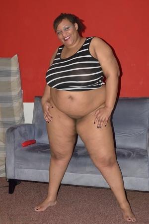 Obese black woman Curvy Bunny B oils up her tits before toying her vagina