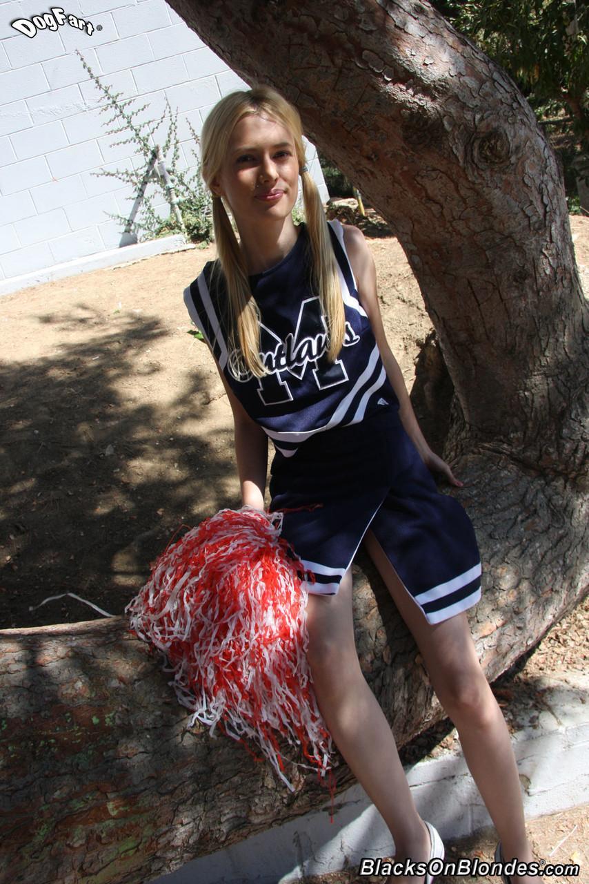 Skinny blonde cheerleader Kennedy Kressler gives it up to a massive black cock(1)