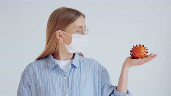 Attractive Female Doctor Hold Coronavirus Joke - VideoHive 26147314