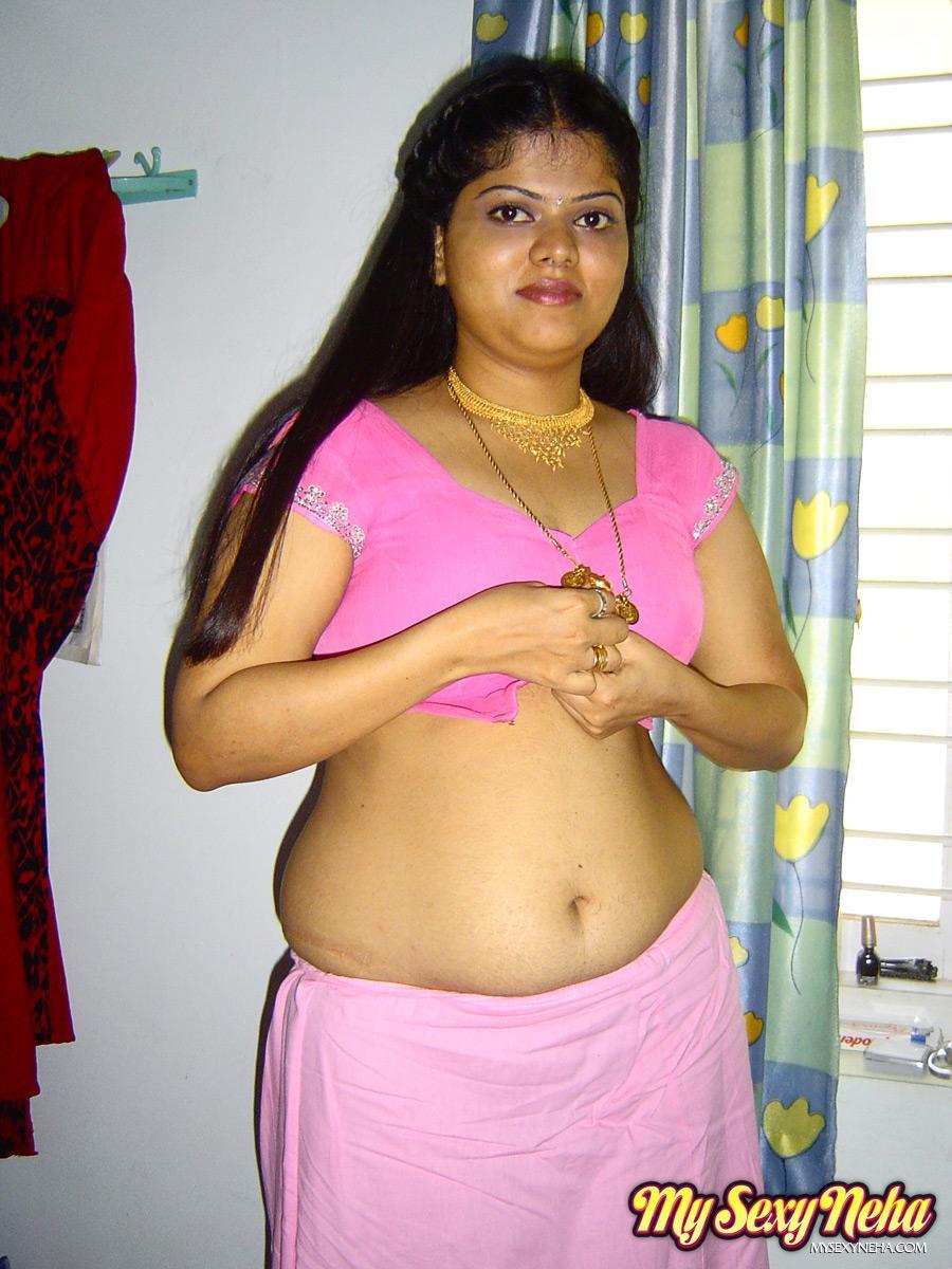 Plump Indian girl Neha gets totally naked on her bed in solo action(3)