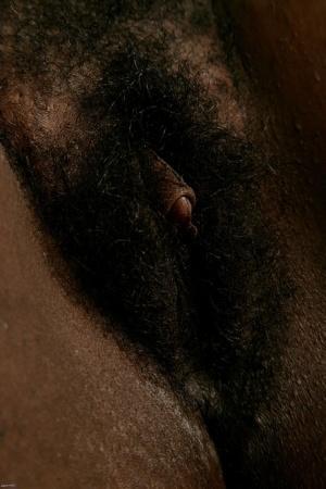 Chubby black babe Chocolate strips naked & spreads her hairy pussy up close