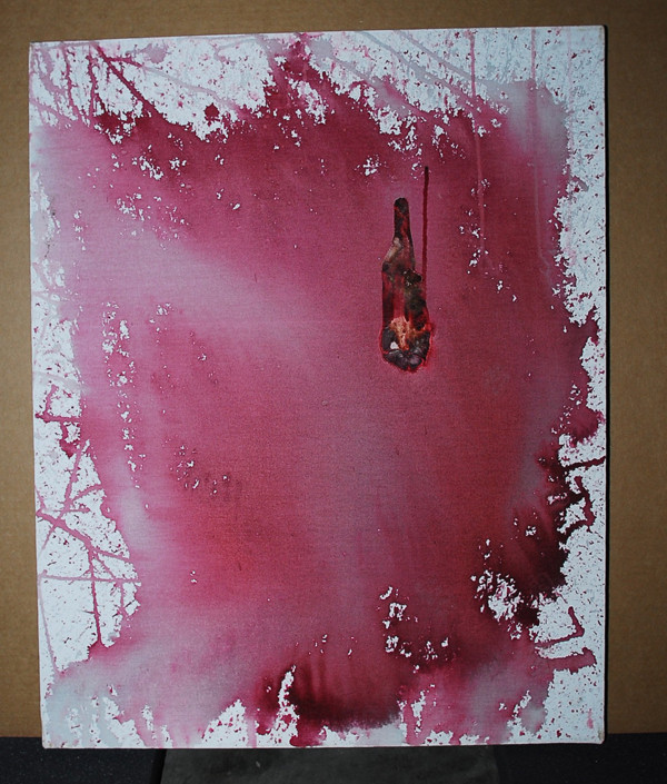 Red paint is splattered on a white background, resembling blood. In the upper right quadrant, there is a chunky mass that might be either dried paint or real dried blood.