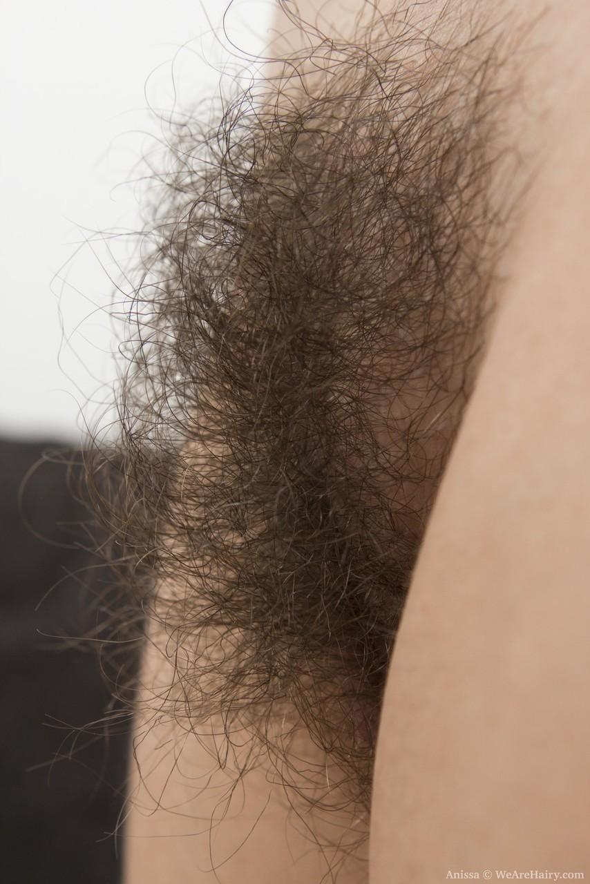 Young first timer with black hair wears a smile while unveiling her hairy bush(16)