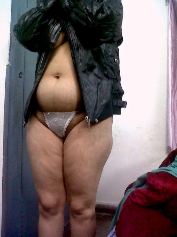 Fat Indian woman hides her face while adorned in a bra and thong(4)