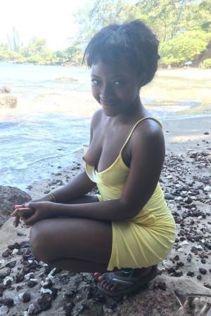 Little Afro-American teen Noemie Bilas shows her tits & choco holes in a solo