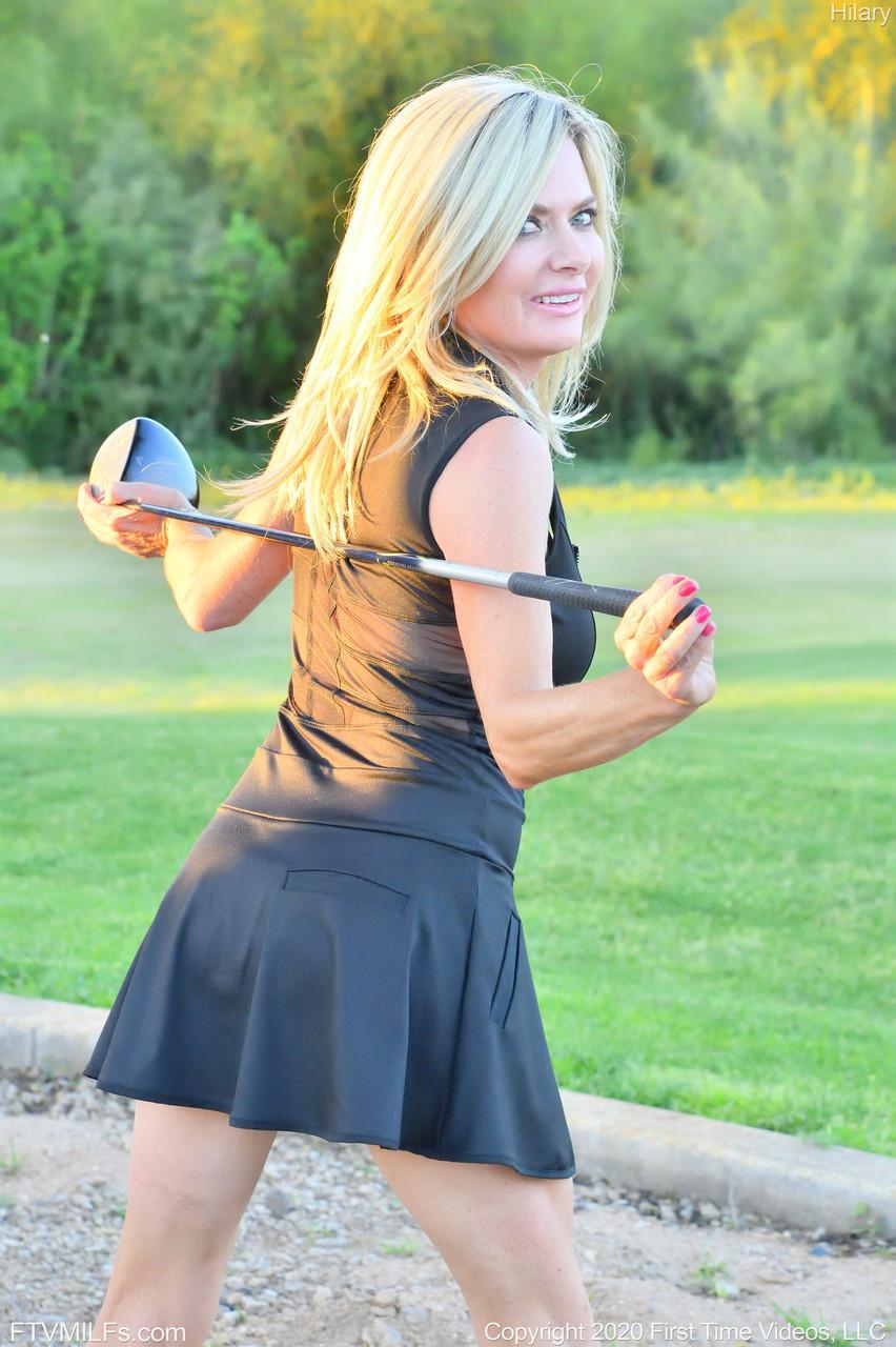 Seductress Hilary flashes her panties & shows her cleavage while playing golf(14)