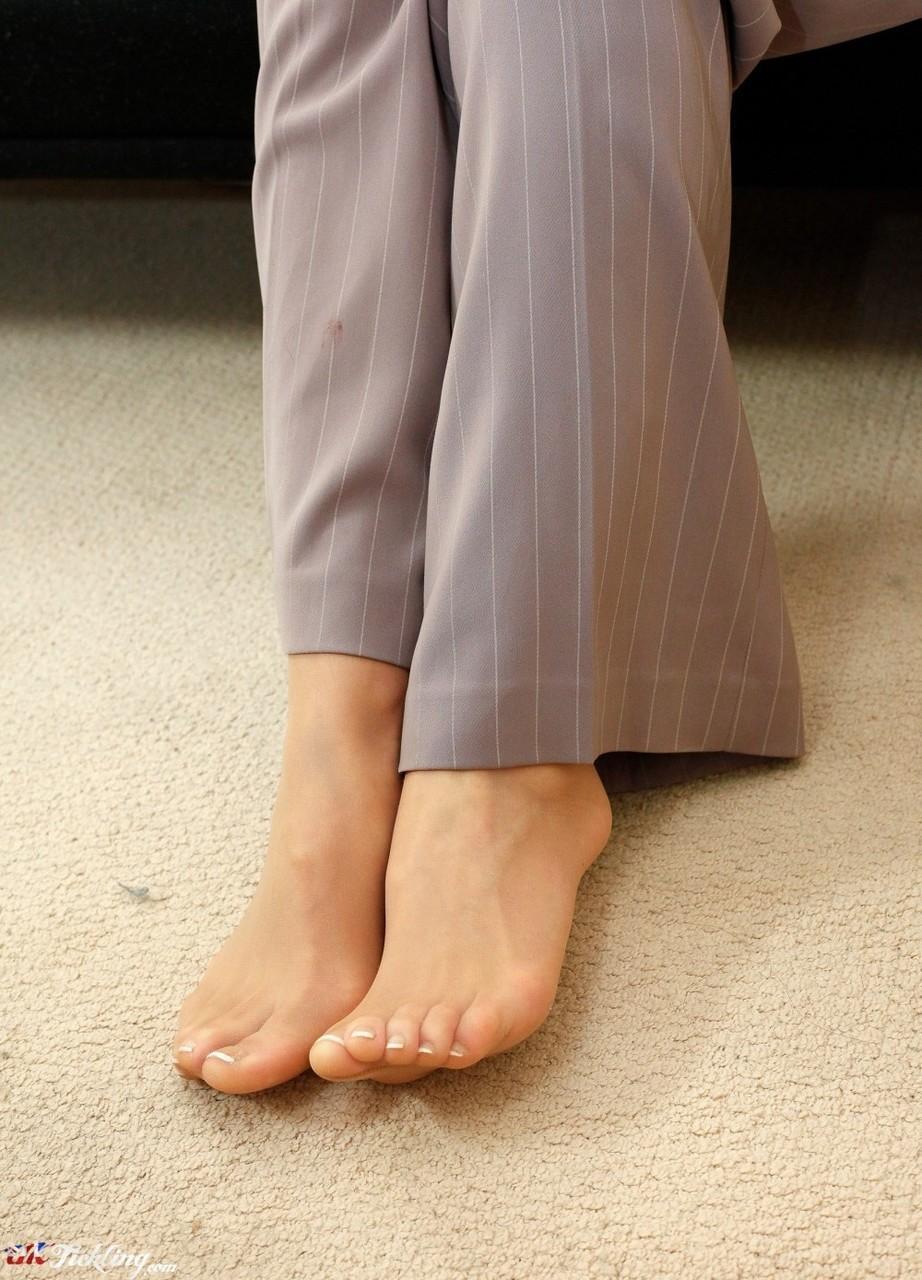 Blonde female Chacha shows her hose clad feet in a business suit(11)