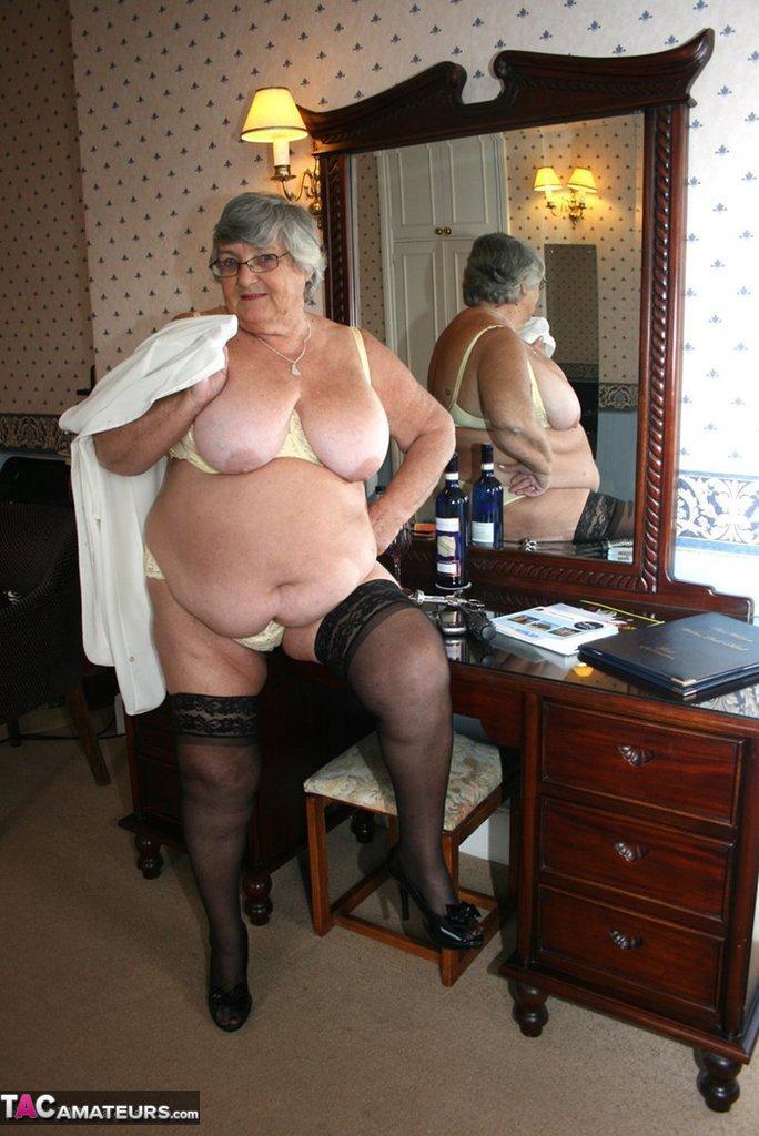 Fat grandmother with short grey hair has phone sex in black stockings only(9)