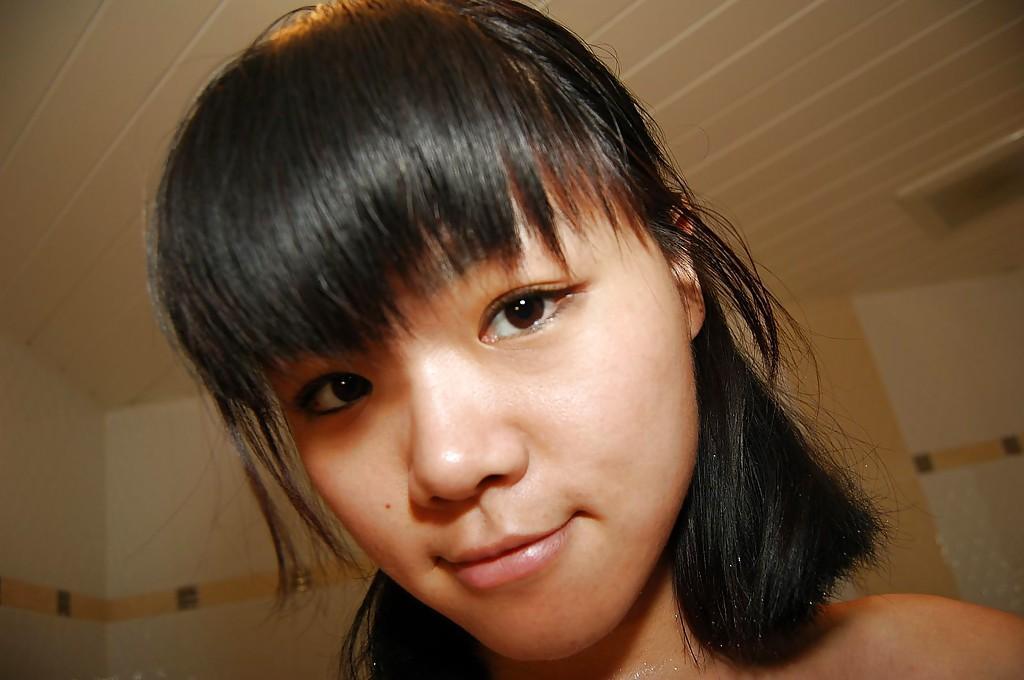 Shy asian sweetie taking shower and teasing her hairy honey pot(8)