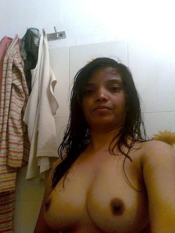 Indian female exposes her big natural tits during candid action at home(7)