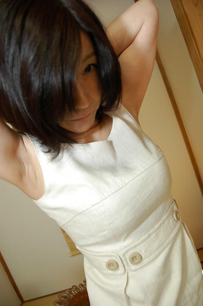 Naughty asian mature lassie getting nude and exposing her shaggy gash(5)