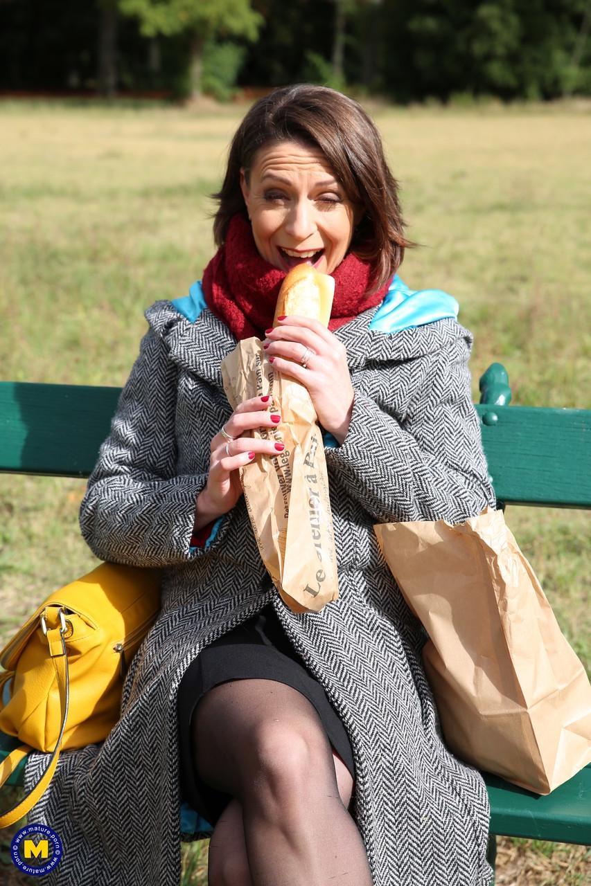 French mom Anya flashes her legs in stockings while eating a sandwich outside(4)