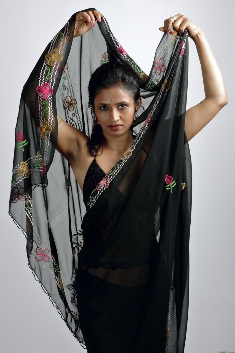 Slender Indian woman removes her sari to model in black lingerie(4)