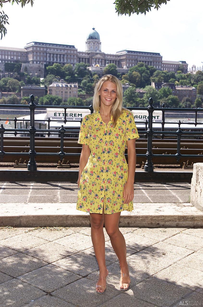 Blonde teen Krisztina removes her yellow dress and flaunts her body in public(10)