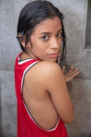 Cute Latina teen Karin Torres toying her irresistible pussy in the shower