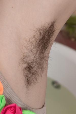 Slender cutie with bushy armpits Fiorella unveils her hairy cunt in bathtb