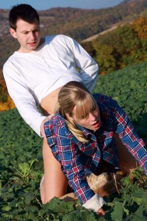 Blonde girl and her boyfriend have sex in a crop field away from prying eyes