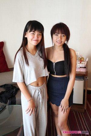 Petite Asian amateurs Sprite and Mon strip and pose naked together