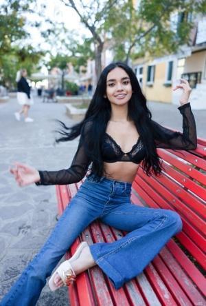 Sexy Latina teen Dulce poses in her lace bra, top and blue jeans in public