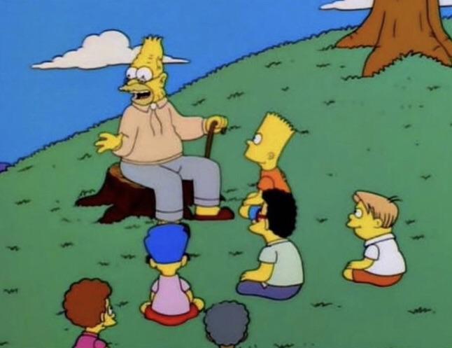 Abe Simpson seduto su un tronco che racconta una storia ai bambini attorno
