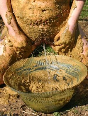 Thick amateur Mary Bitch drinks her own pee while playing in mud like a sow