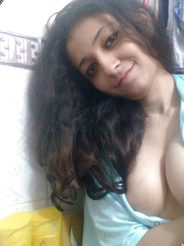 Indian solo girl holds her face firm while letting nipples free of lingerie(7)