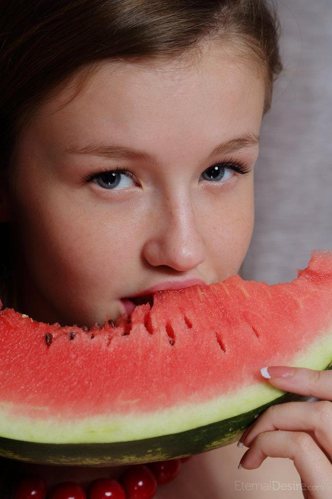 Sweet young Emily Bloom gets watermelon juice on her cute face & shaved pussy(8)