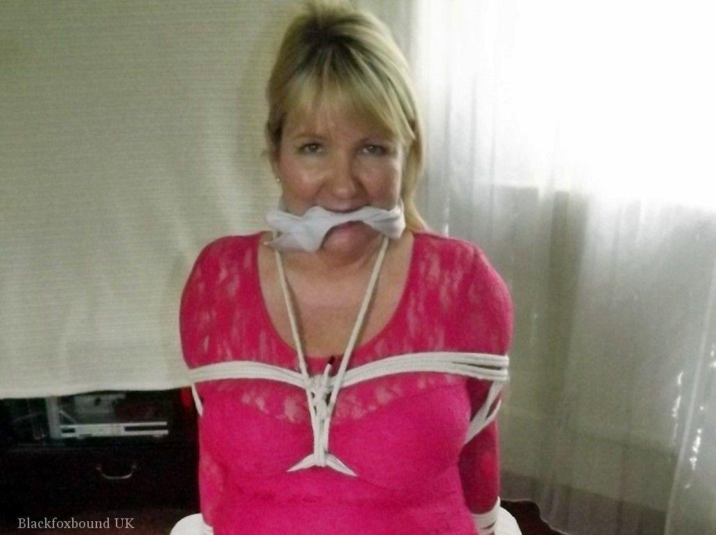 Mature lady with blonde hair ha her big naturals exposed after being tied up(16)