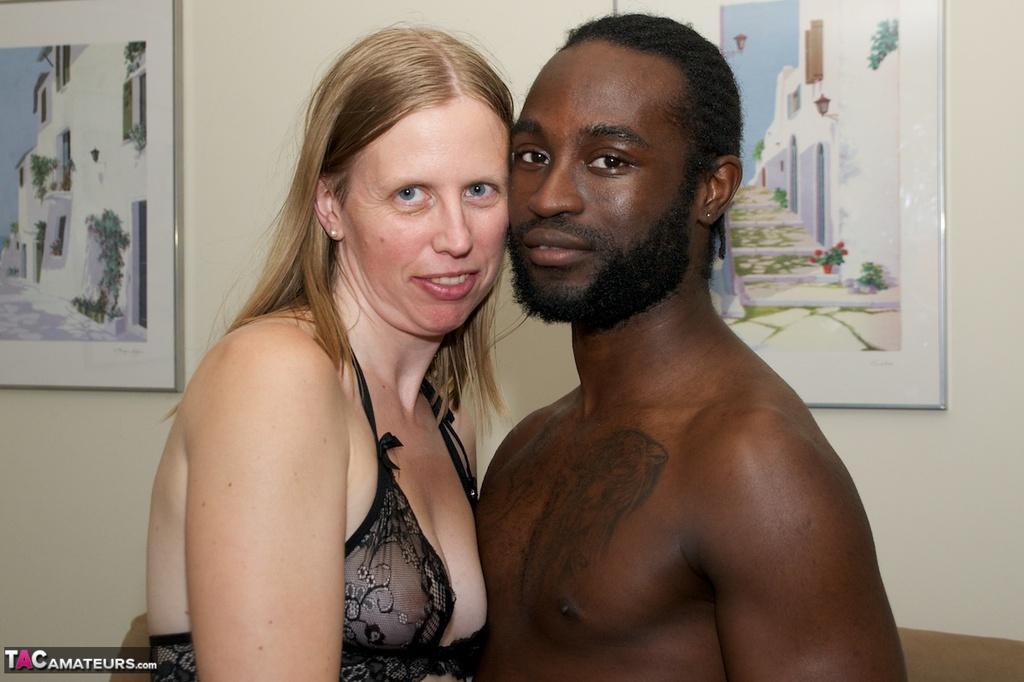 White amateur deepthroats her black lover's cock in lingerie ensemble(1)