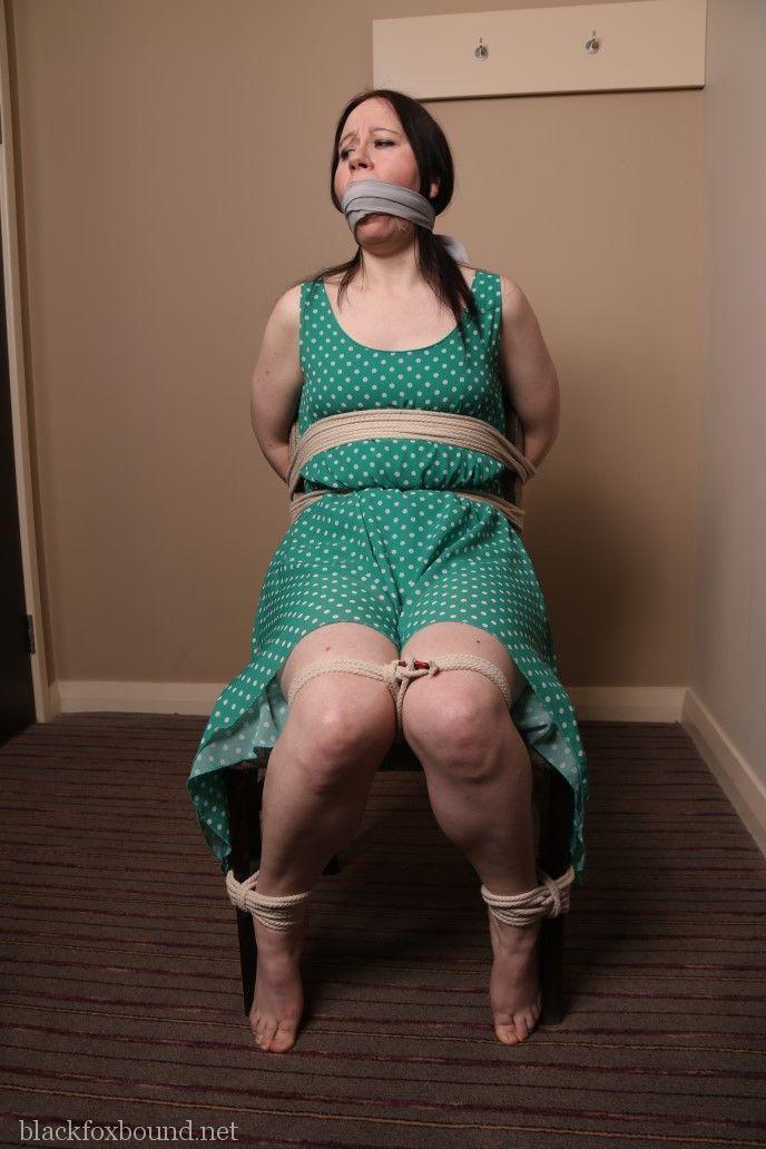 Distressed mature woman in polka-dot dress tied up & gagged for BDSM fun(14)