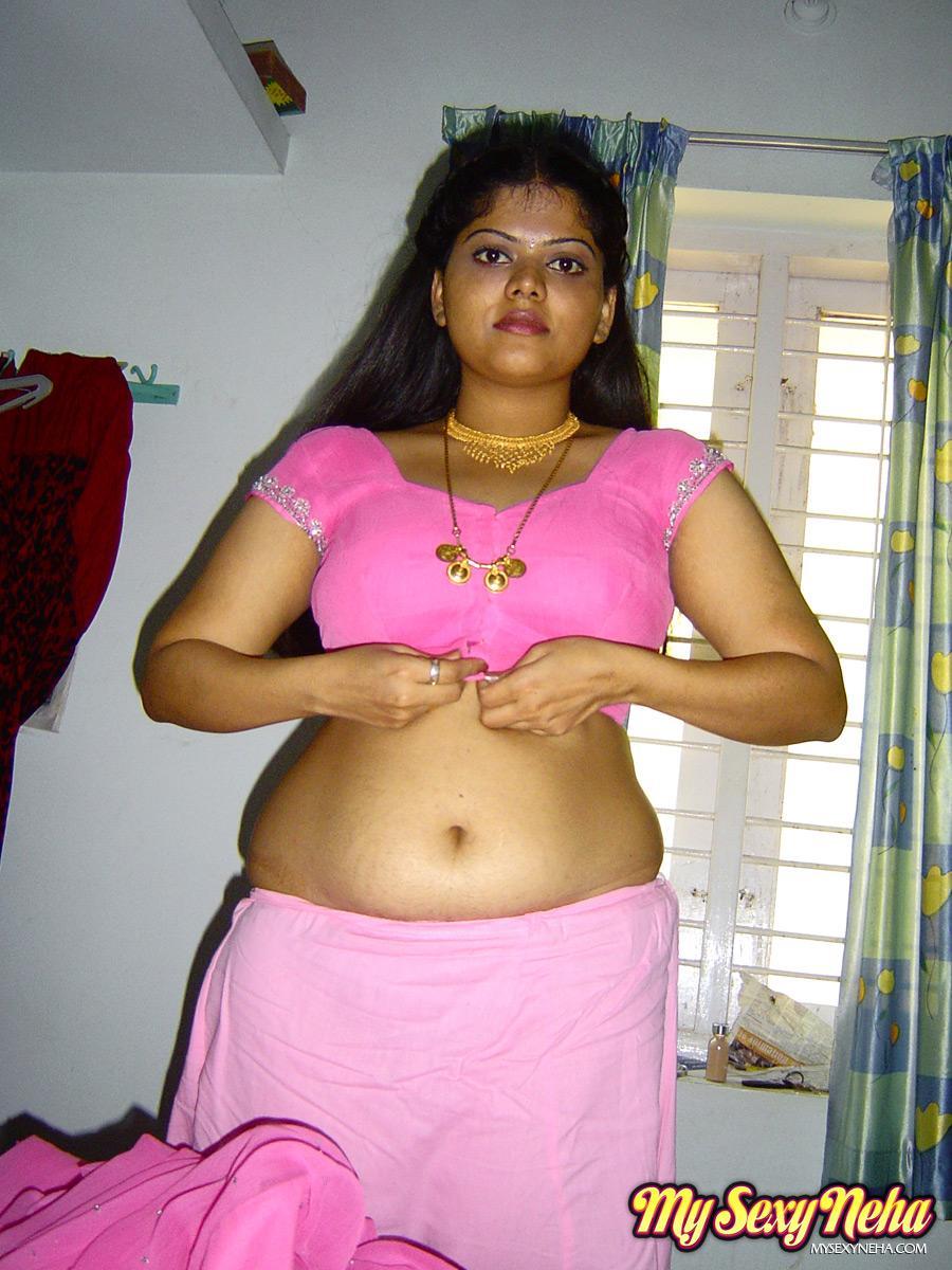 Plump Indian girl Neha gets totally naked on her bed in solo action(2)