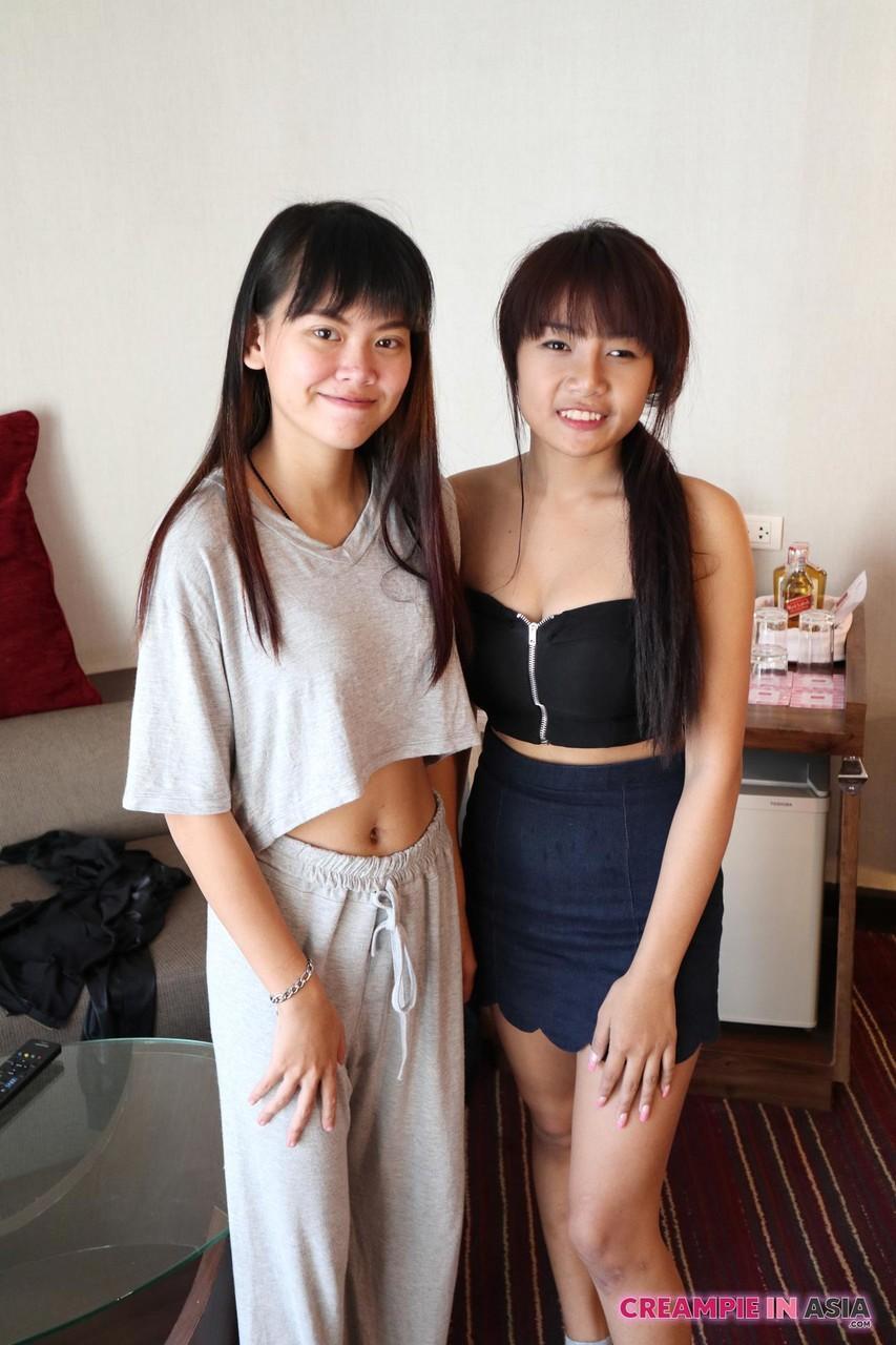 Petite Asian amateurs Sprite and Mon strip and pose naked together(3)