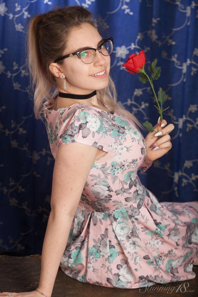 Nerdy 18 year old Liza Loo holds a rose showing her firm breasts in glasses(1)