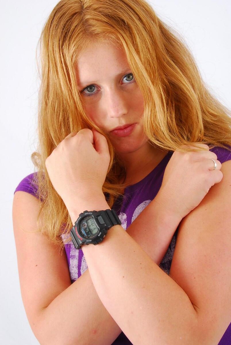 Natural redhead Judy models a black G-Shock watch while fully clothed(11)