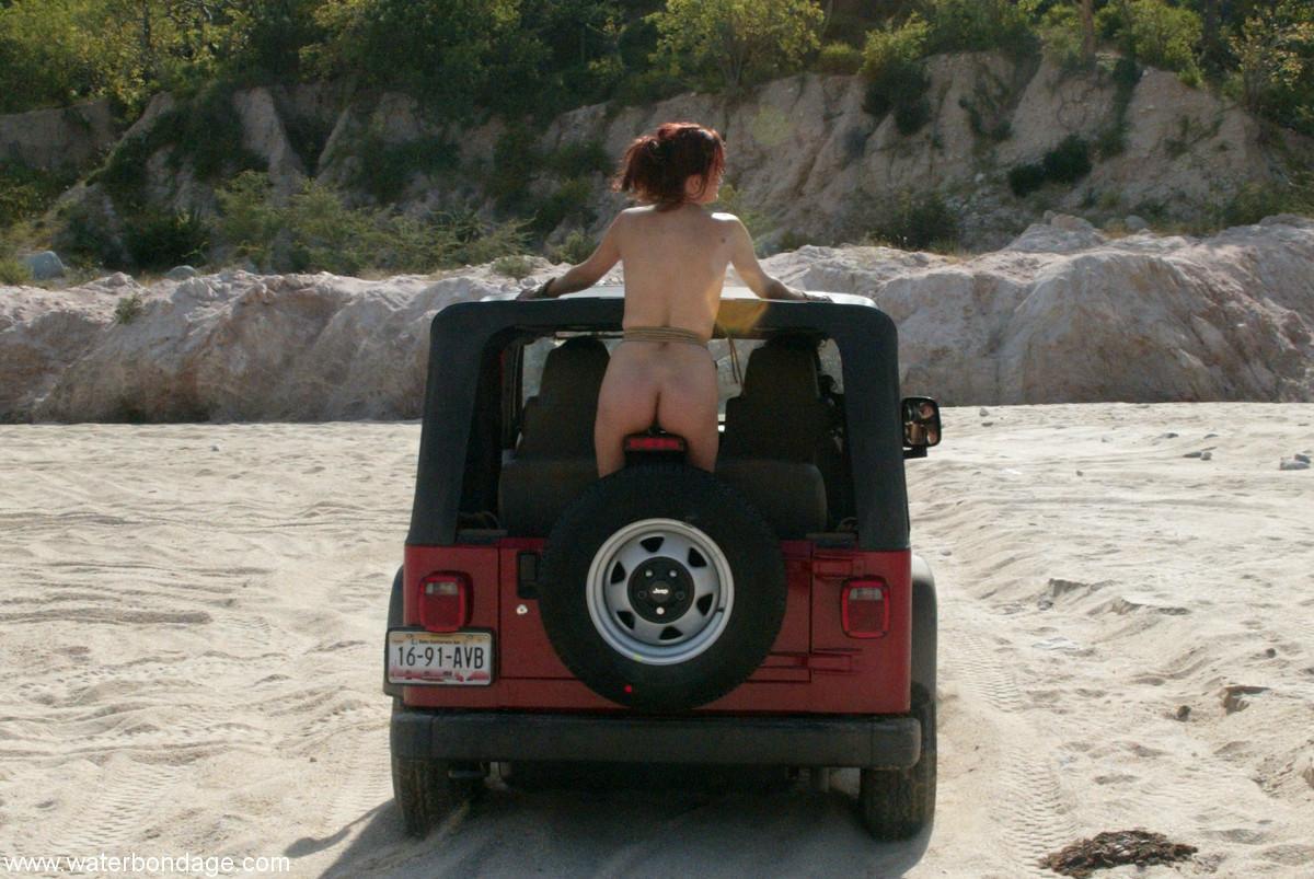 Sexy MILF with amazing breasts Sasha Monet gets tied naked to a Jeep(11)