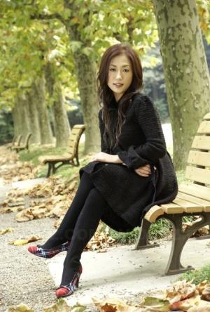 Fully clothed Japanese teen models in the park in black clothes and stockings