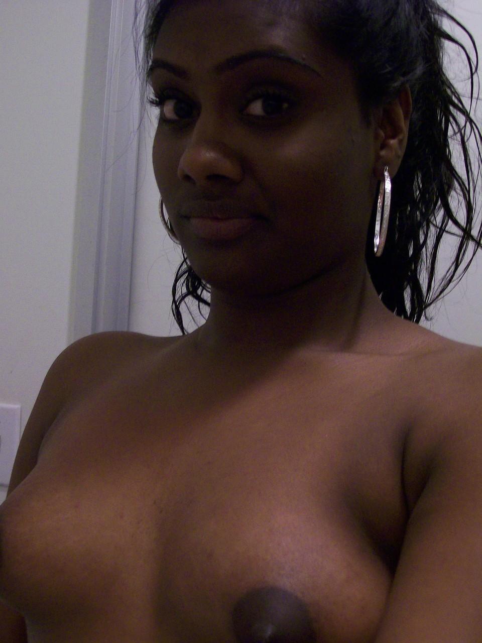 Ebony teen Paris takes selfies while showing her big ass & puffy nipples(16)